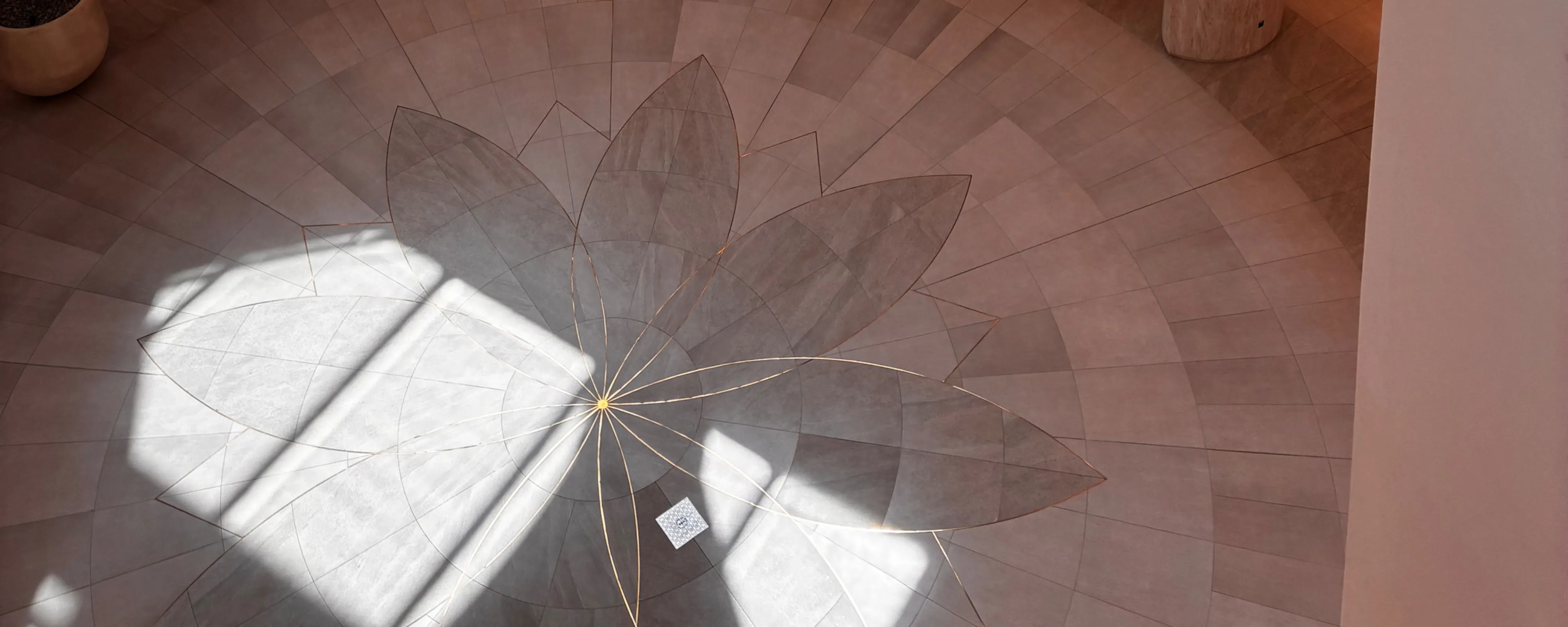 Sunlight falling through a window onto a tiled floor